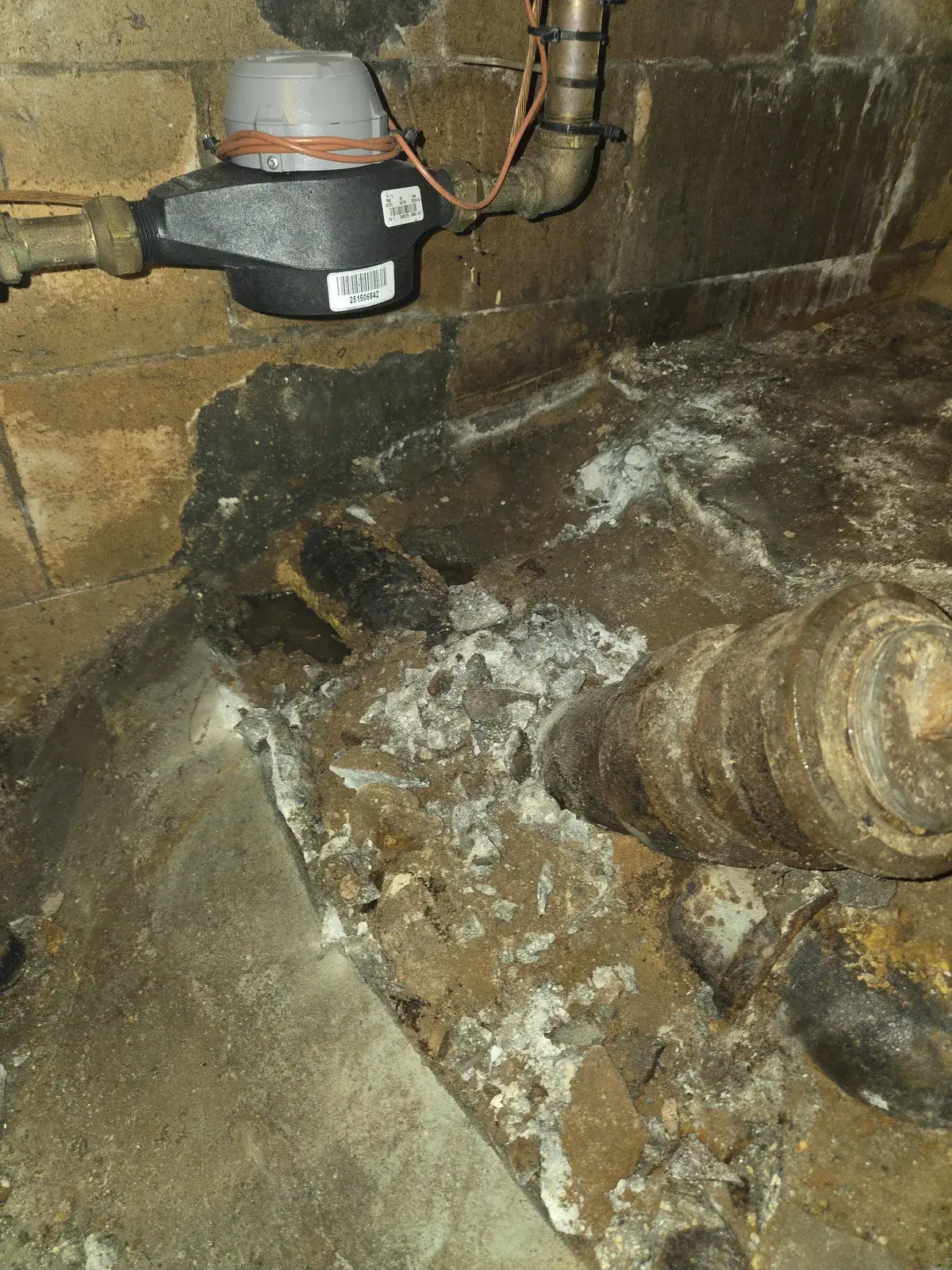Corroded house trap uncovered before removal