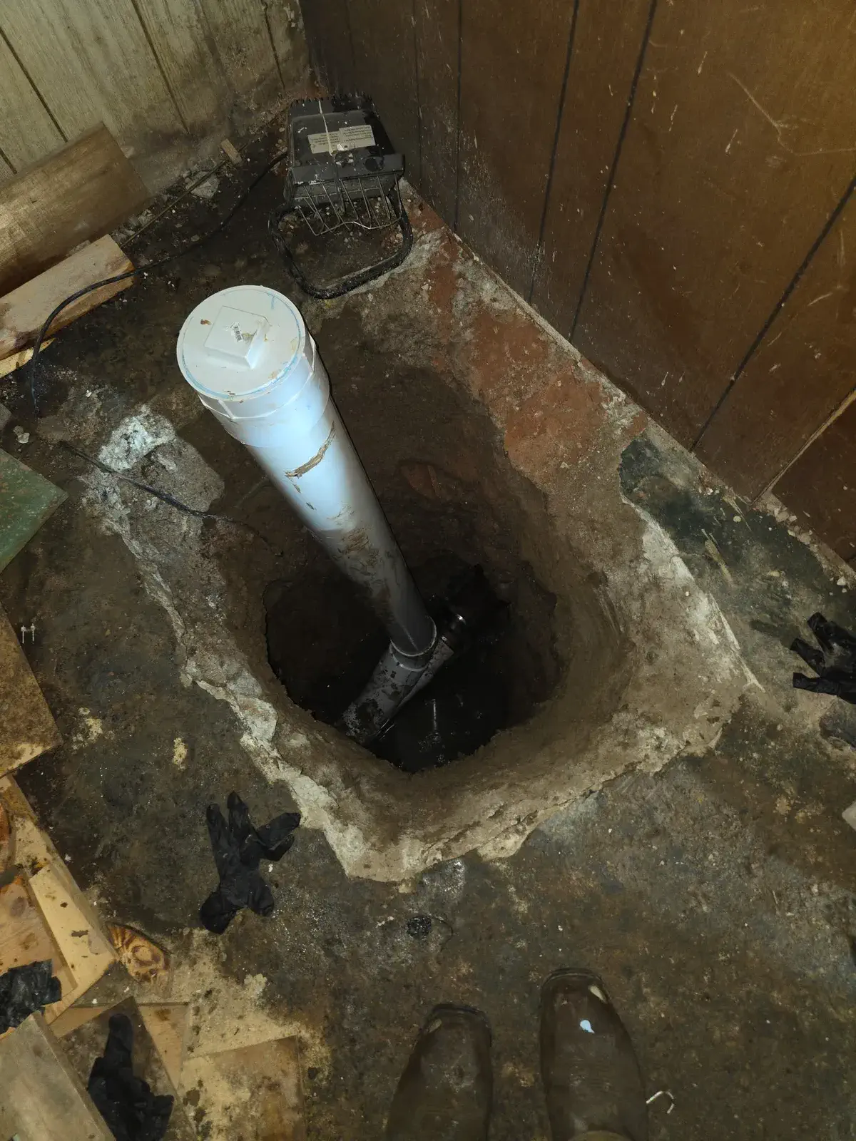 New cleanout riser set into a basement floor