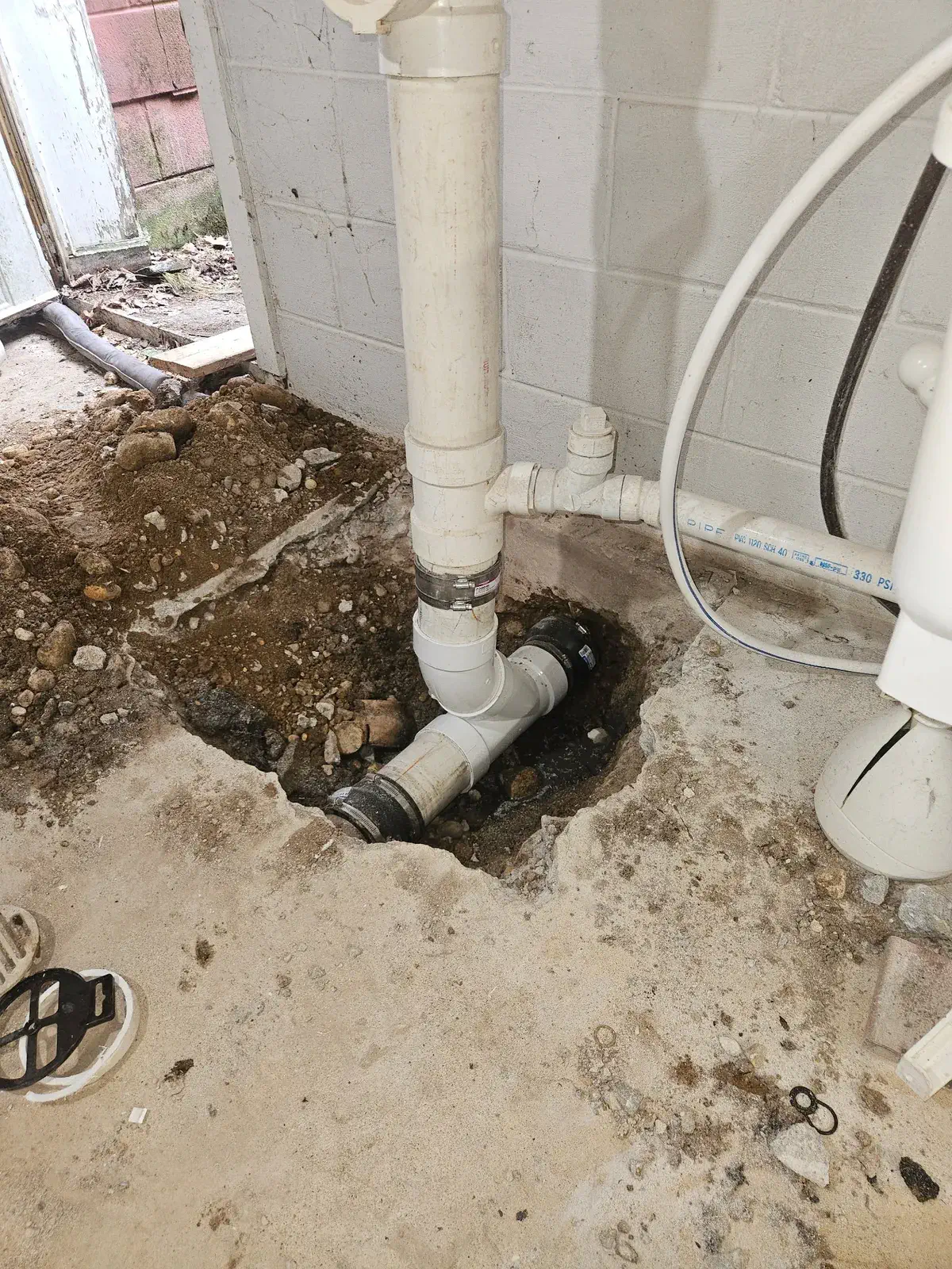 New sewer connection made in a basement floor