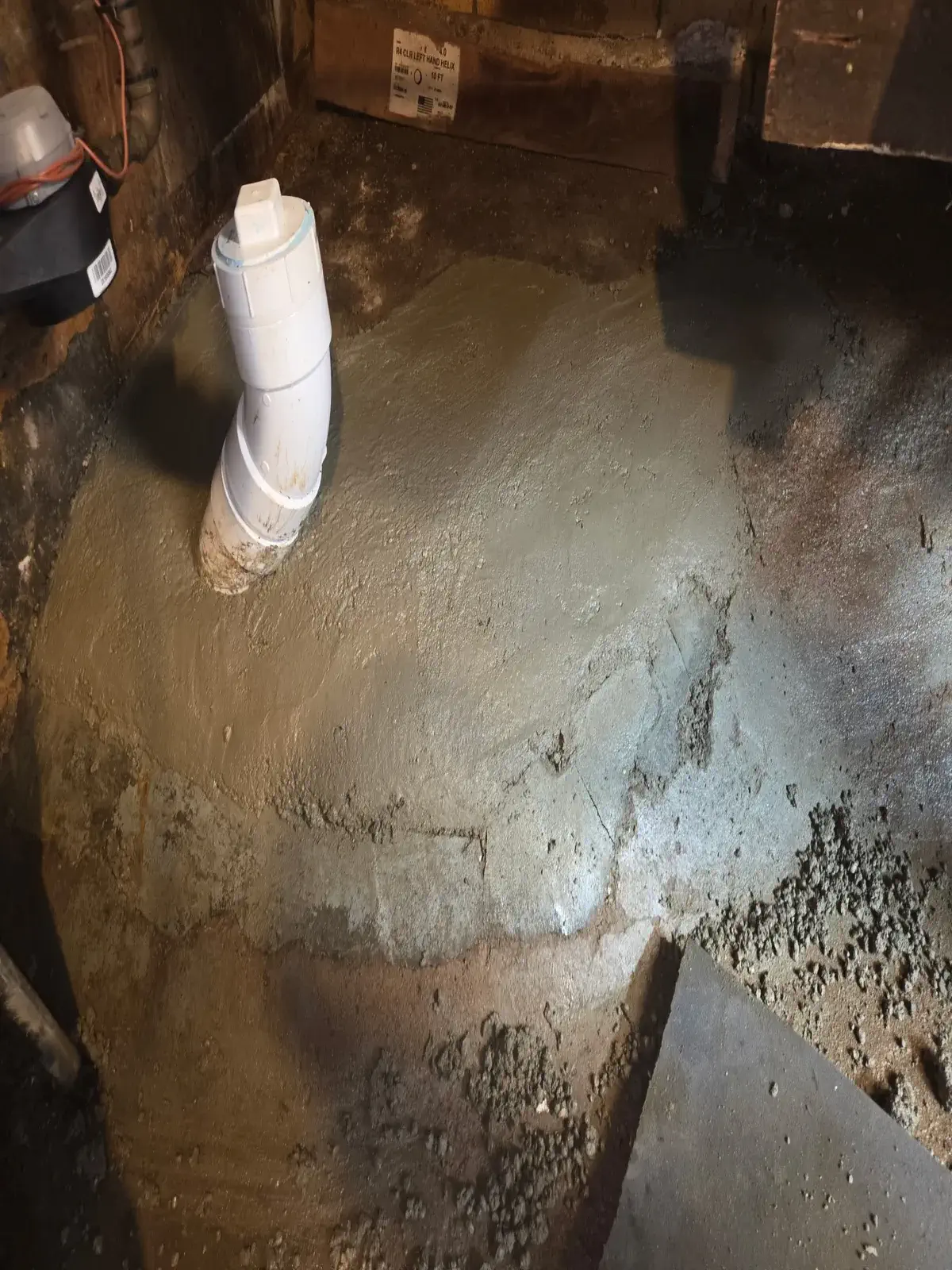 Sewer line entering a basement through the foundation